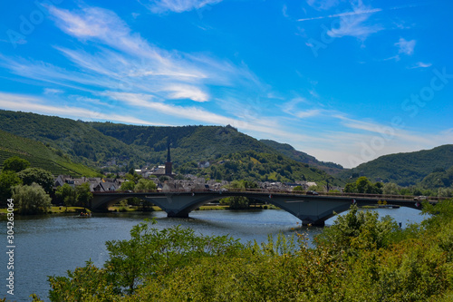 views of a village, a bridge and the rin river rhein in germany landscape sunny day