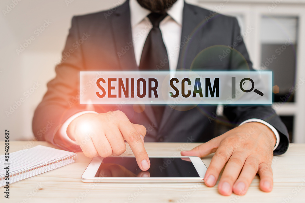 Conceptual hand writing showing Senior Scam. Concept meaning fraud schemes targeting the lifestyle and savings of the elderly Male human wear formal clothes present use hitech smartphone Conceptual hand writing showing Senior Scam. Concept meaning fraud schemes targeting the lifestyle and savings of the elderly Male human wear formal clothes present use hitech smartphone