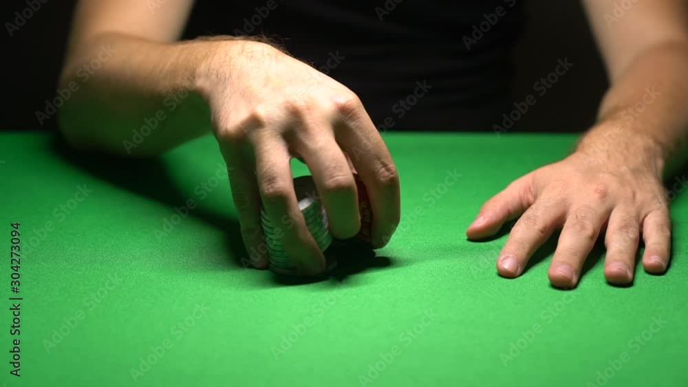 poker chips in the hands of the player poker chips in the hands of the player