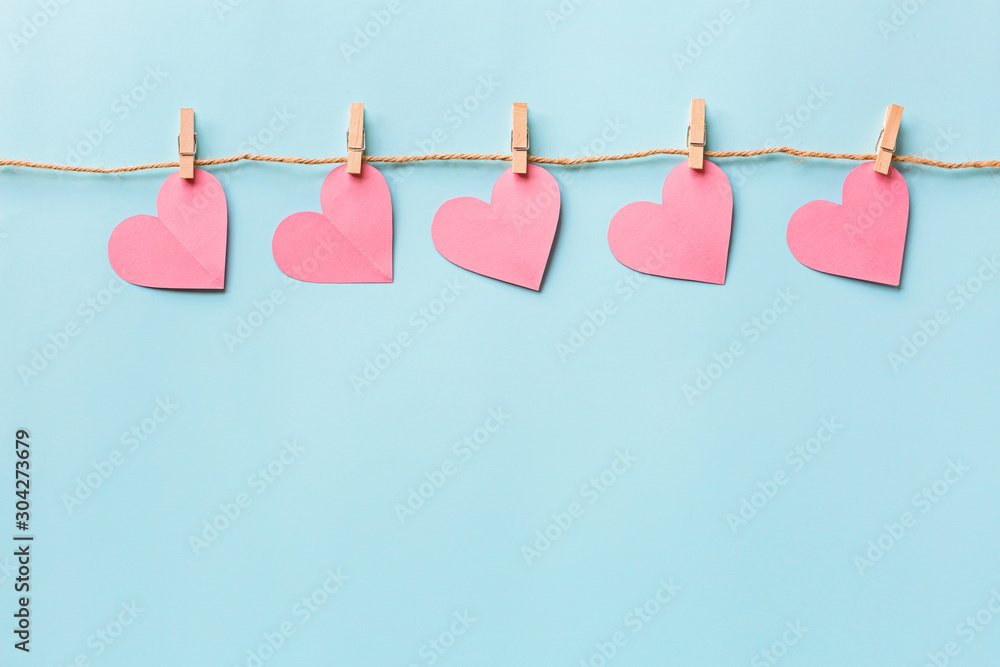 Valentine's day background with hearth on blue. Flat lay, top view, mockup, template, copy space. Minimal abstract composition for 14 February celebration