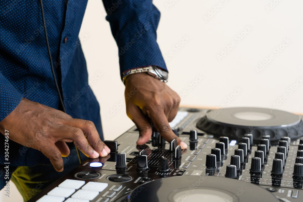 Dj mixes the track in the nightclub at party Dj mixes the track in the nightclub at party