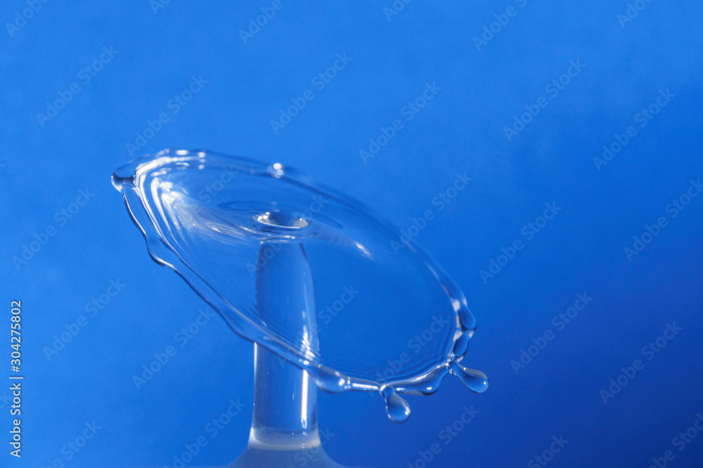 Water drop collision form with blue background