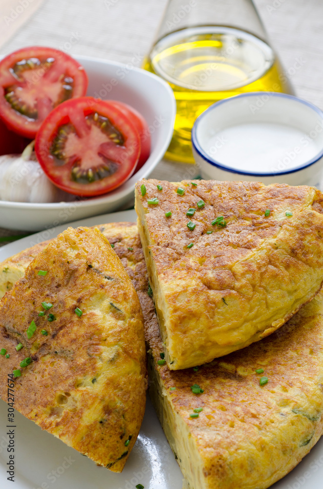 Spanish omelette with chopped tomato - Spanish food Spanish omelette with chopped tomato - Spanish food
