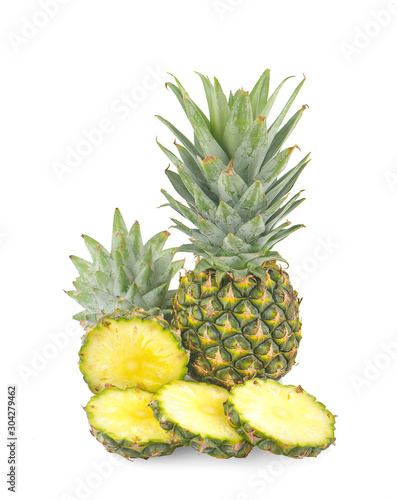 Fresh whole and cut pineapple an isolated on white background