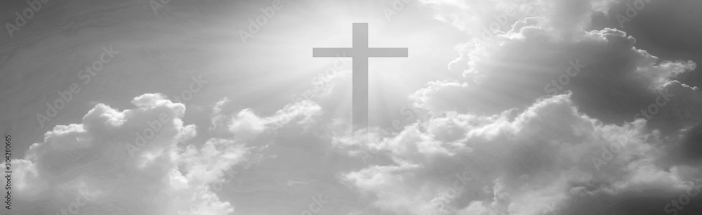 Christian cross appeared bright in the sky with soft fluffy clouds, white, beautiful colors. With the light shining as hope, love and freedom in the sky background