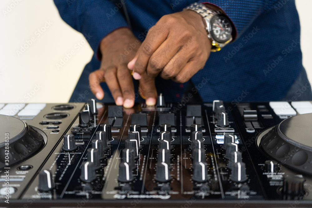 Dj mixes the track in the nightclub at party Dj mixes the track in the nightclub at party