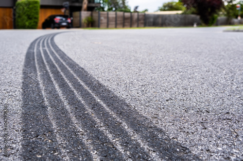 Tyre track on asphalt from hard braking - shallow focus