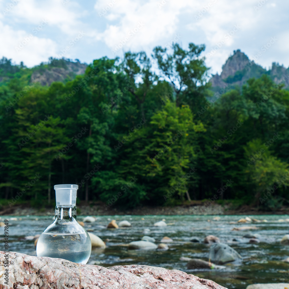 Glass flask with clean drinking water. Glass flask with clean drinking water.