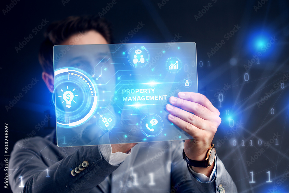 Planning marketing strategy. Business, Technology, Internet and network concept. Businessman working on the tablet of the future, select on the virtual display: Property management Planning marketing strategy. Business, Technology, Internet and network concept. Businessman working on the tablet of the future, select on the virtual display: Property management