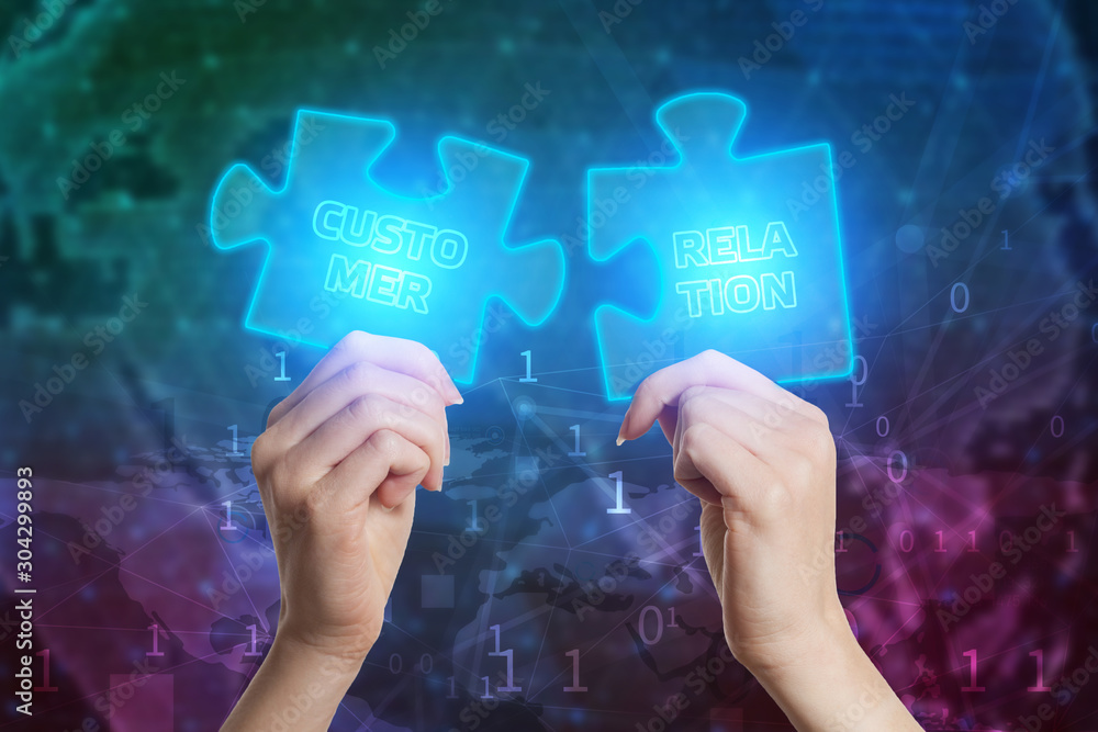 The concept of business, technology, the Internet and the network. Business solutions, success and strategy concept. Businessman hand connecting jigsaw puzzle. Customer retention The concept of business, technology, the Internet and the network. Business solutions, success and strategy concept. Businessman hand connecting jigsaw puzzle. Customer retention
