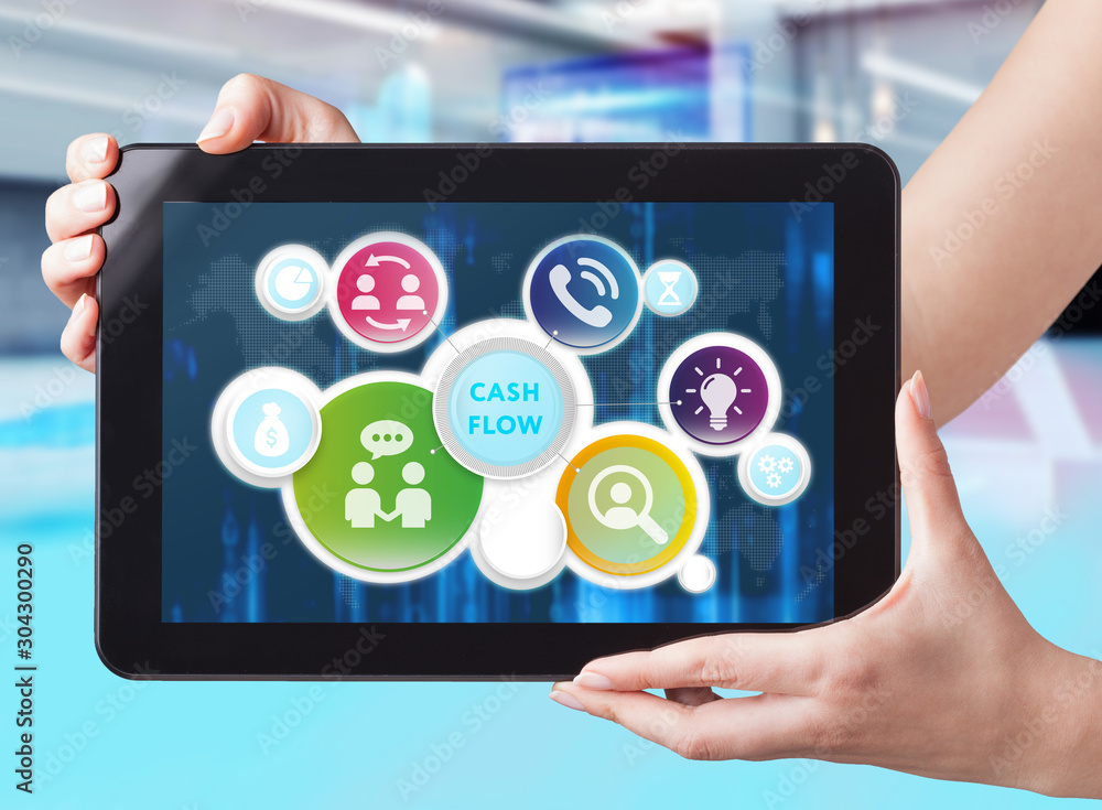 Business, Technology, Internet and network concept. Business man working on the tablet of the future, select on the virtual display: cash flow Business, Technology, Internet and network concept. Business man working on the tablet of the future, select on the virtual display: cash flow