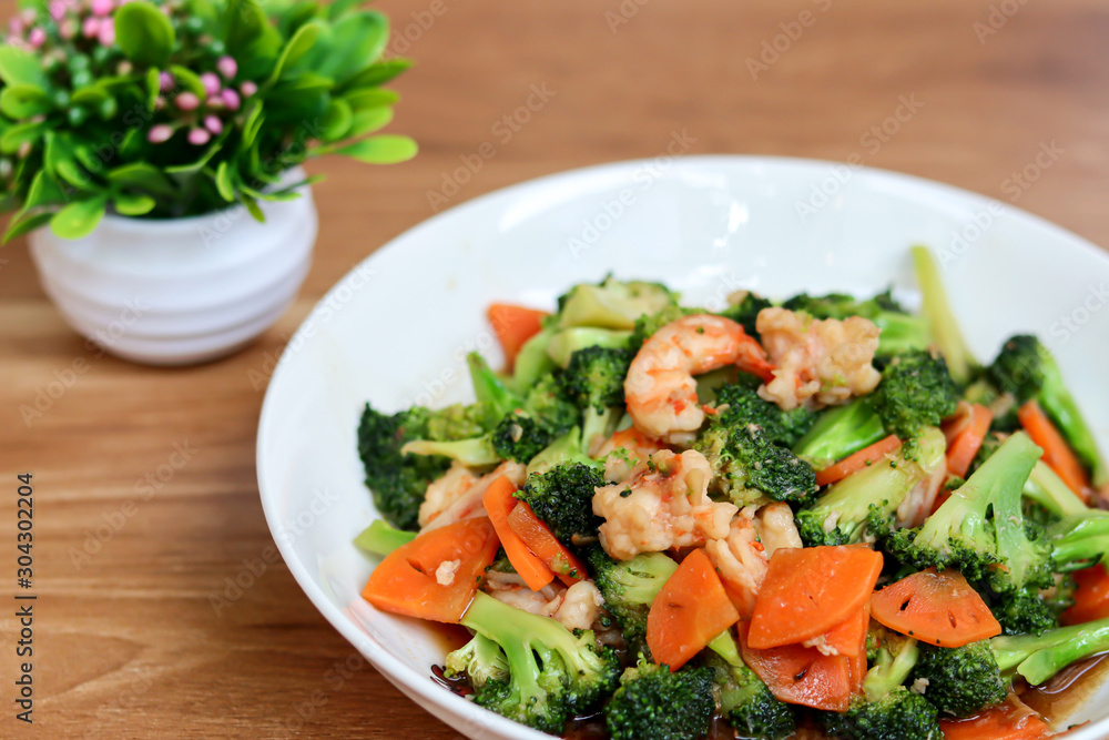 Stir Fried Broccoli with Shrimp on wooden table. Stir Fried Broccoli with Shrimp on wooden table.