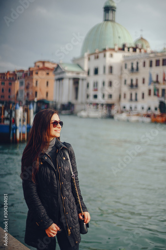female tourist walking around and exploring venice in the early spring © prostooleh