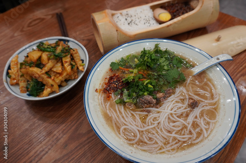 Delicious Naxi style chicken broth rice noodles, braised pork rice with chili fried potatoes as dinner.