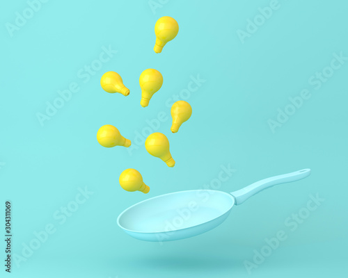 Yellow light bulb floating with blue pan on pastel blue background. minimal idea concept.