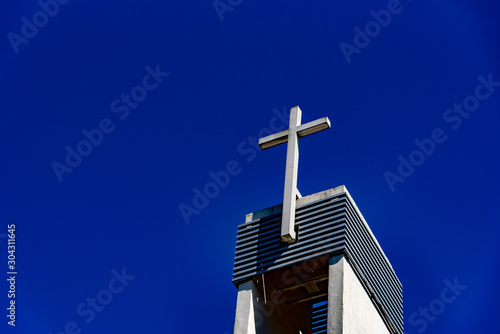 The church tower and the cross symbol of Christianity