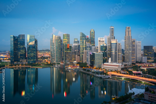 Panorama of Singapore business district skyline and skyscraper at twilight night at Marina Bay, Singapore. Asian tourism, modern city life, or business finance and economy concept. © ake1150