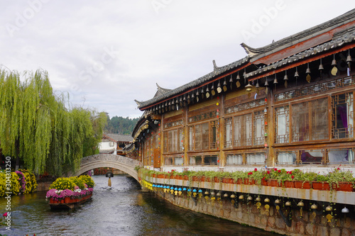 Shuhe Old Town is an UNESCO World Heritage Site in 1997. It built along the jade mountains and river flowing around. The old-time architecture and shopping street. © peacefoo