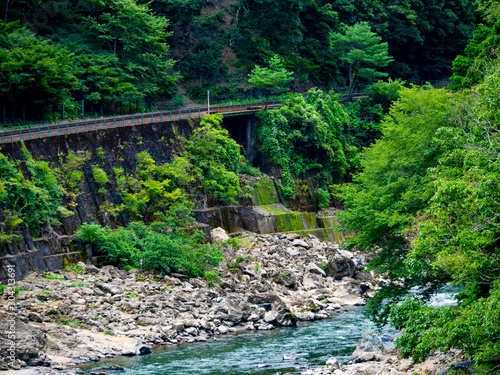 Katsura River and Sagano sightseeing railway trolley train. Arashiyama, Nishikyo-ku, Kyoto-shi, Kyoto photo