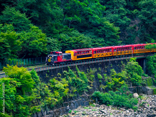 Katsura River and Sagano sightseeing railway trolley train. Arashiyama, Nishikyo-ku, Kyoto-shi, Kyoto photo