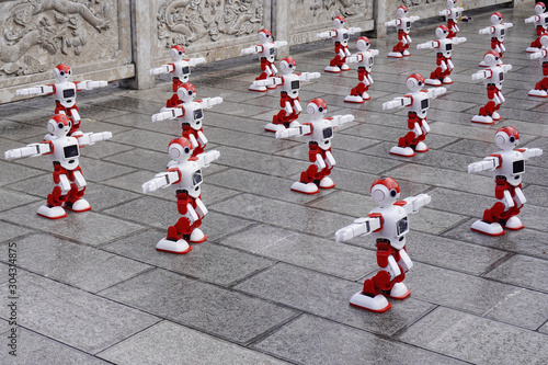 Robots dancing in the park. Artificial intelligence industry in China.                      