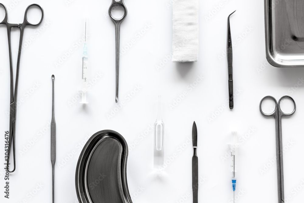 Instruments for plastic surgery on white background top view flat lay pattern Instruments for plastic surgery on white background top view flat lay pattern
