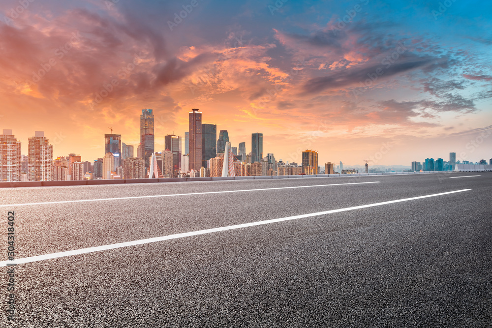 Sunset empty asphalt road and city skyline in Chongqing