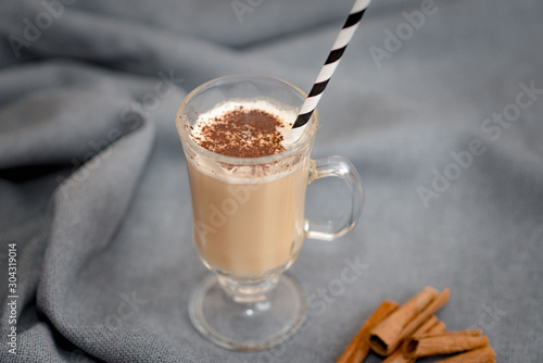 Traditional winter eggnog with milk, rum and cinnamon, sprinkle chocolate, selective focus.Close up.