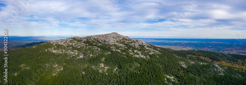 Aerial panoramic view of rocky Mount Monadnock summit during fall day 
