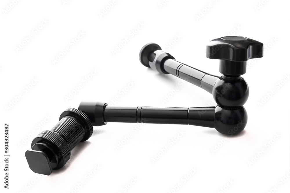 Magic Arm Articulating Friction Arm with Hot Shoe Mounts for DSLR Camera. Black photo accessories. Isolated on a white background. Copy space. Magic Arm Articulating Friction Arm with Hot Shoe Mounts for DSLR Camera. Black photo accessories. Isolated on a white background. Copy space.