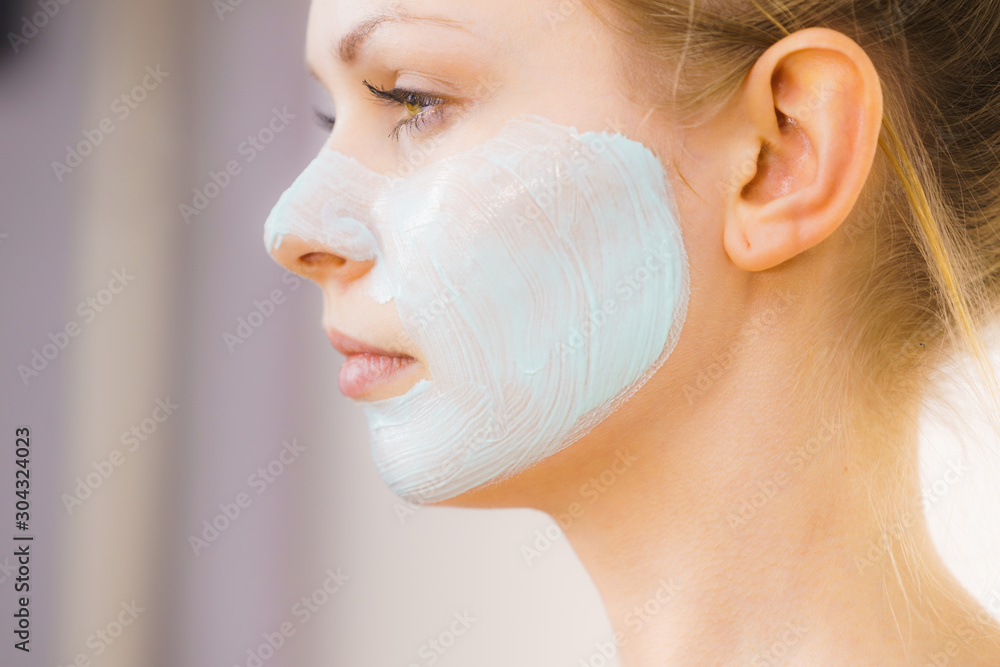 Girl with green mud mask on face Girl with green mud mask on face