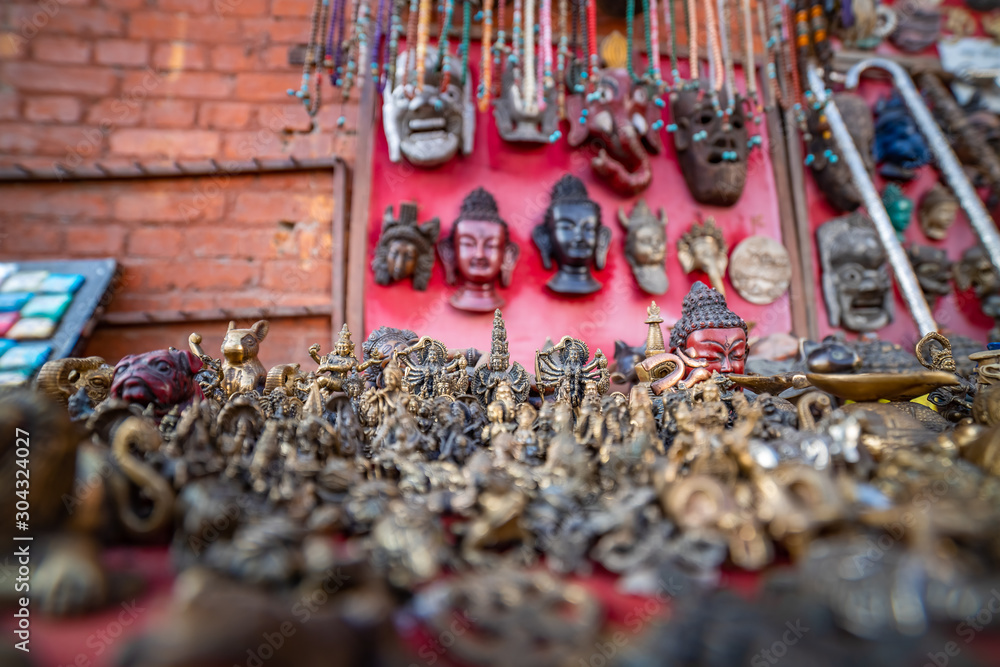 shop selling masks and souvenirs on the square near Swayambhunath stupa in Kathmandu valley, Nepal