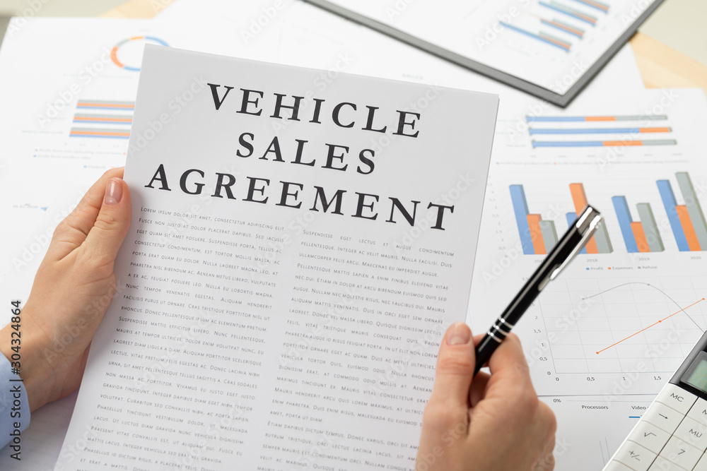 venicle sales agreement concept, documents on the desktop venicle sales agreement concept, documents on the desktop