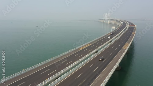 Drone flight of huge Jiaozhou Bay Bridge in Qingdao, infrastructure engineering and transportation development in China photo