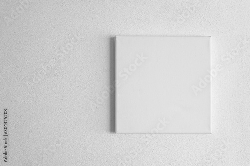 single  white rectangular canvas frame on cement wall background