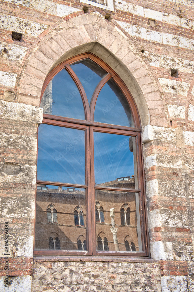 Traditional ancient window with reflection