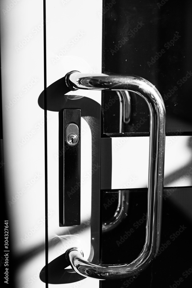 door handle with lock on a sheet metal door with windows Stock Photo ...