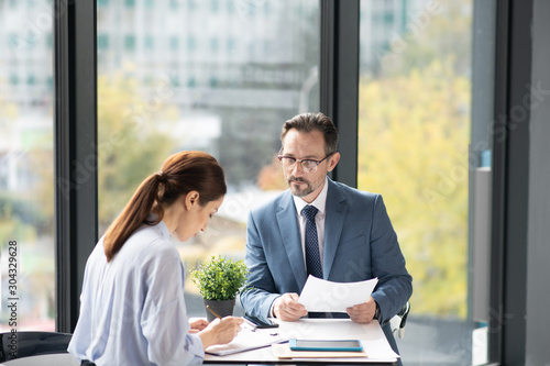 Businessman feeling involved in discussion with business partner photo