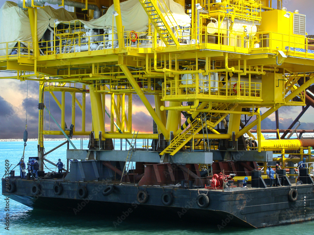 Offshore oil rig platform during construction site in the harbor yard. Offshore oil rig platform during construction site in the harbor yard.