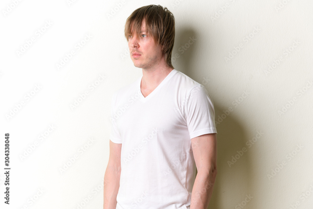 Portrait of young handsome man with long hair thinking Portrait of young handsome man with long hair thinking