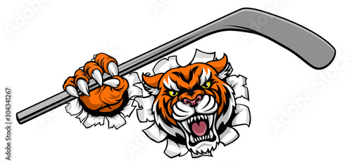 A tiger ice hockey player animal sports mascot holding a hockey stick