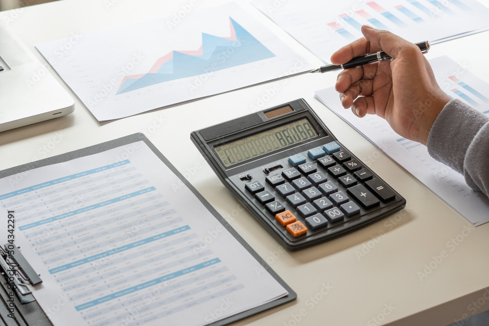 businessman working calculate data document graph chart report marketing research development planning management strategy analysis financial accounting. Business office concept. businessman working calculate data document graph chart report marketing research development planning management strategy analysis financial accounting. Business office concept.