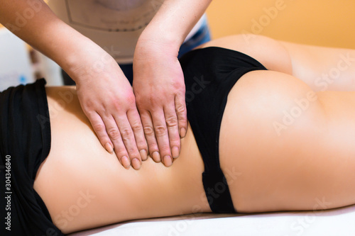 Beautiful woman getting back massage in spa