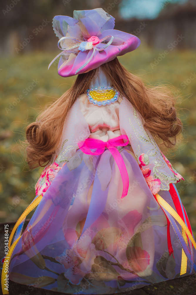 Beautiful elegant ,handmade doll on nature background, magical wish doll Beautiful elegant ,handmade doll on nature background, magical wish doll