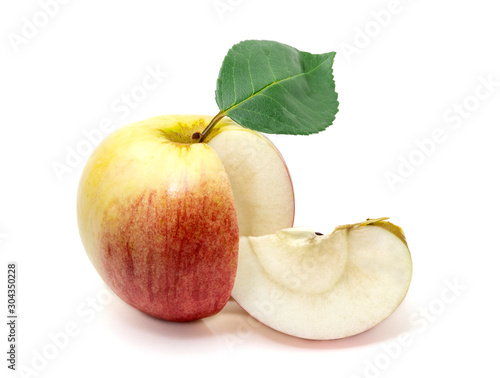 Apple with a leaf and small slice at the side