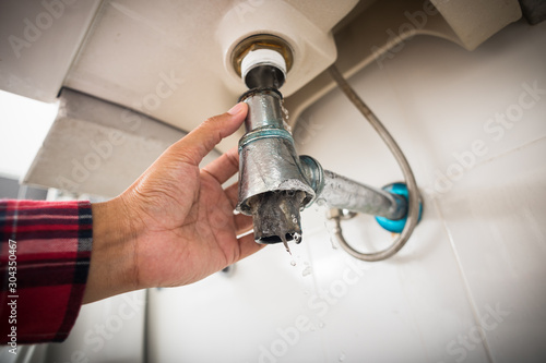 clogged and leaky sink sewer