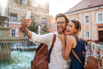 Happy tourist couple in love having fun, travel, smiling on vacation