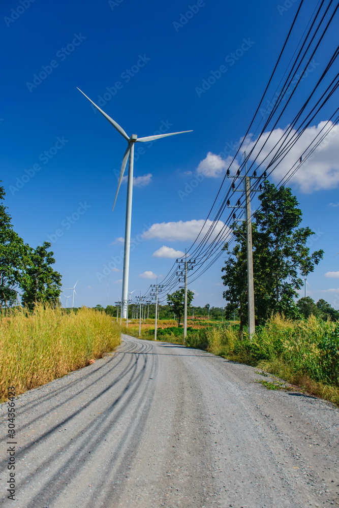 wind turbines for electricity generation with cloud and blue sky