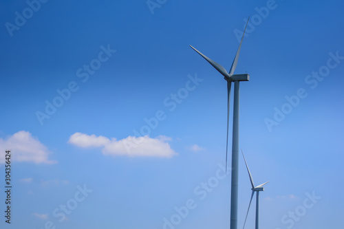 wind turbines for electricity generation with cloud and blue sky