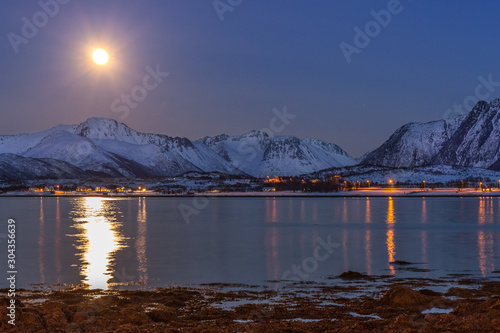 amazing moonrise during blue hours  with beautiful reflection. long shutter speed